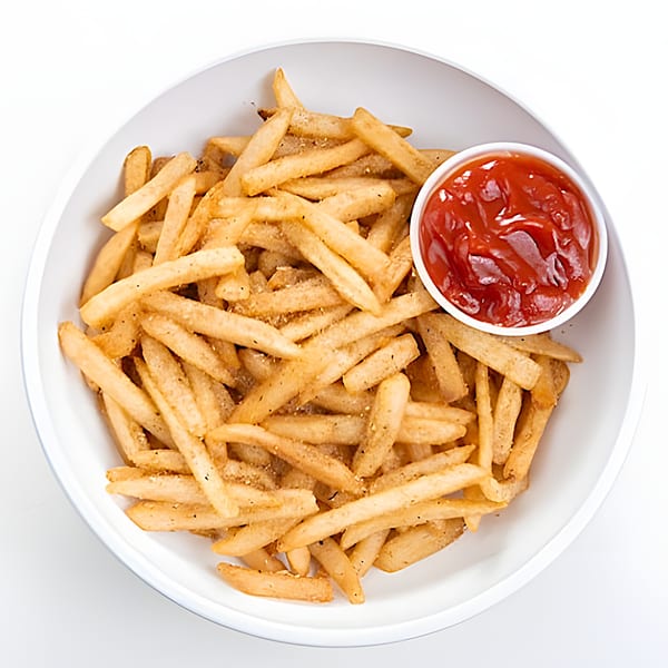 Golden french fries seasoned with spices, served in a white bowl with a side of ketchup.